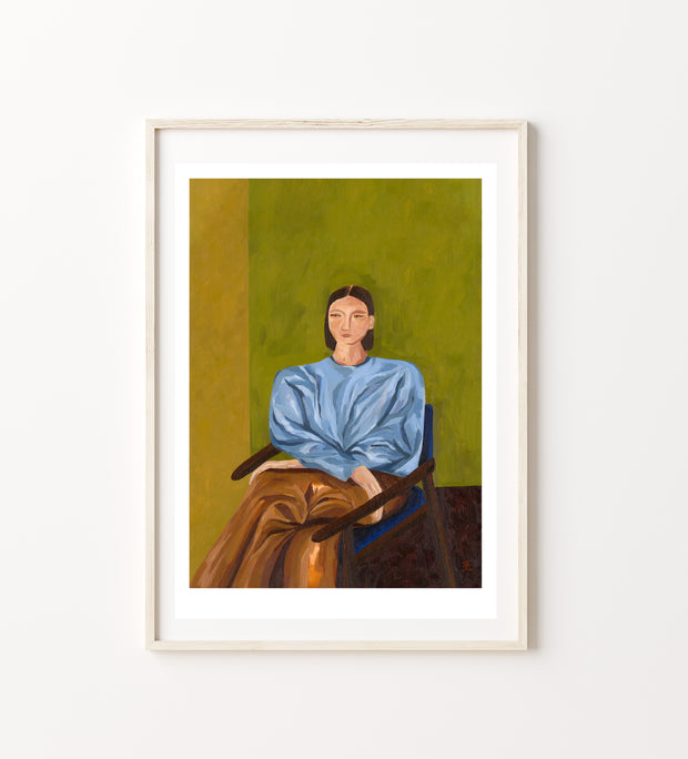 Framed painting of a person wearing a blue shirt and brown pants sat on a chair