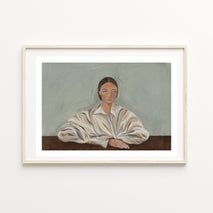 Framed painting of a woman in a white shirt on a light blue /grey background