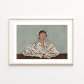 Framed painting of a woman in a white shirt on a light blue /grey background