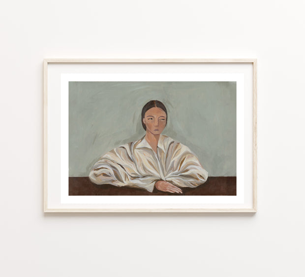 Framed painting of a woman in a white shirt on a light blue /grey background